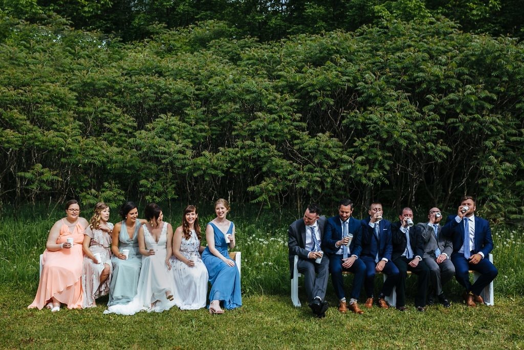 bridal-party-portrait-drinking-on-benches-at-kelowna-british-columbia-wedding