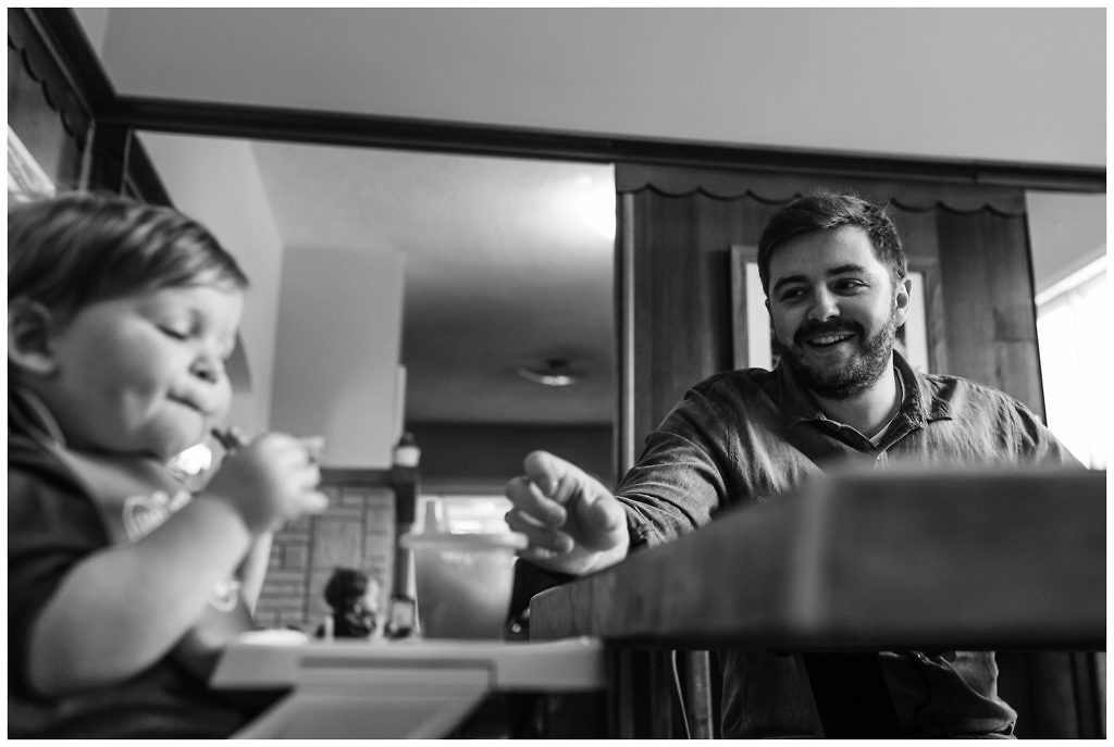 little-boy-and-his-dad-laugh-together-at-the-breakfast-table