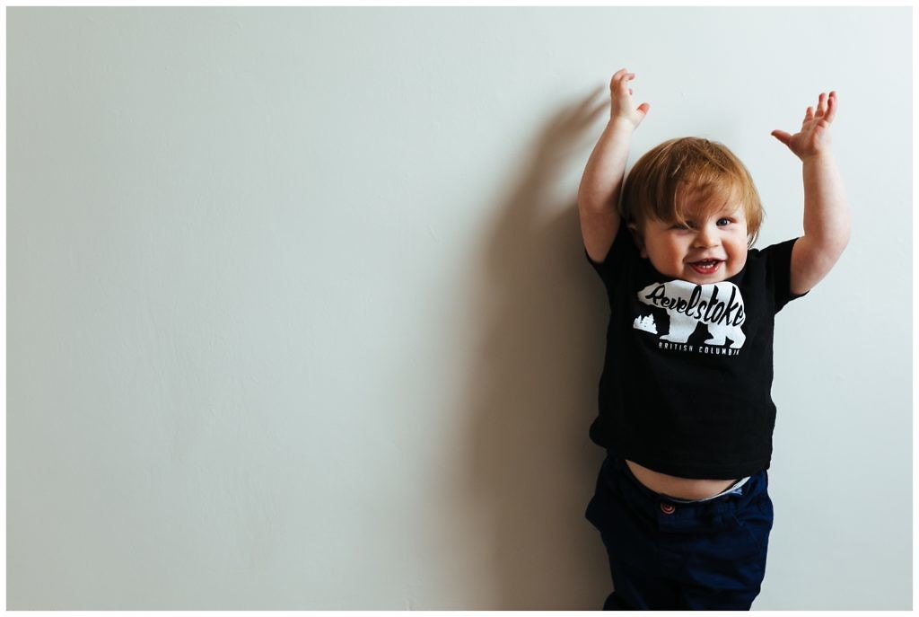 little-boy-cheers-for-joy-while-wearing-a-revelstoke-BC-bear-t-shirt