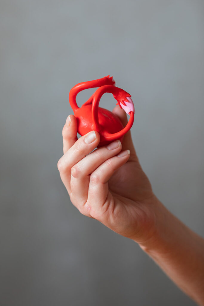 sex-educator-holds-up-model-of-uterus-used-as-an-instruction-tool-for-highschool-students